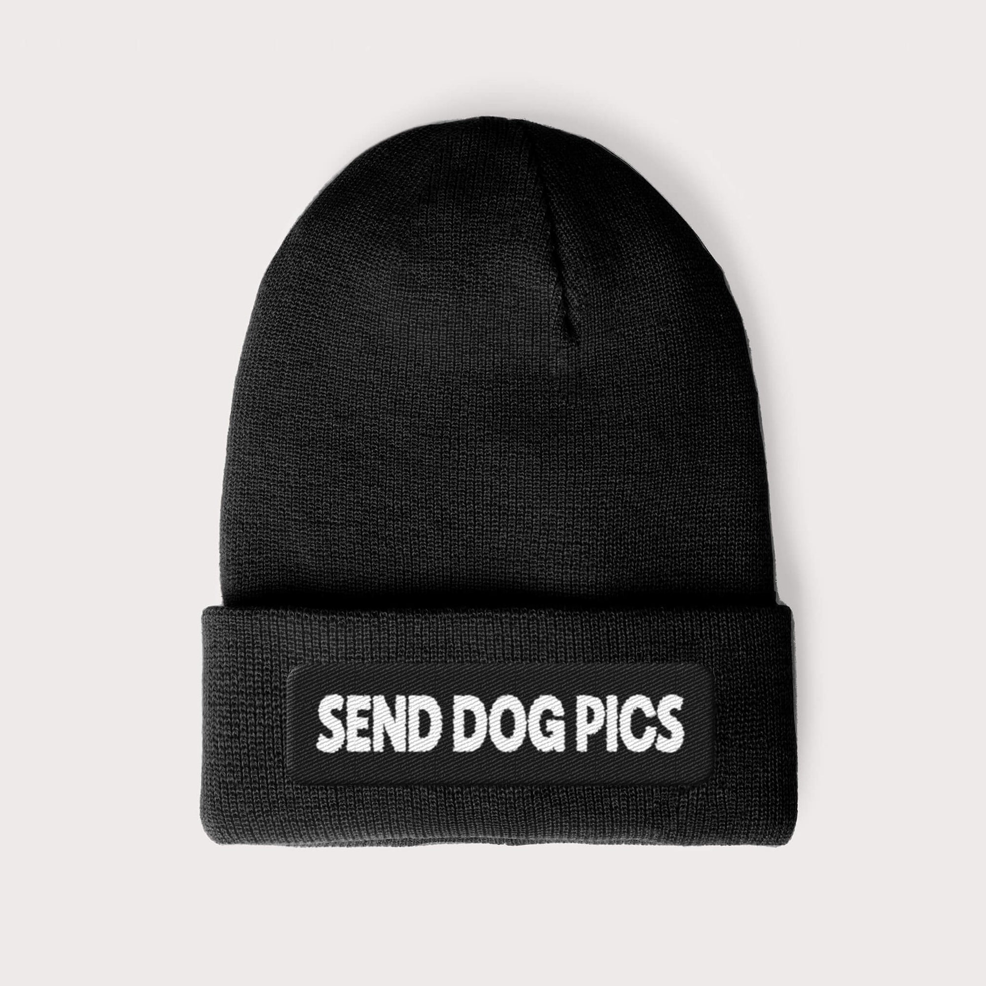 The Send Dog Pics Unisex Beanie from Dogloverclothing.com is a black knit hat for dog lovers, embroidered with SEND DOG PICS in white on the folded brim, against a plain light gray background.