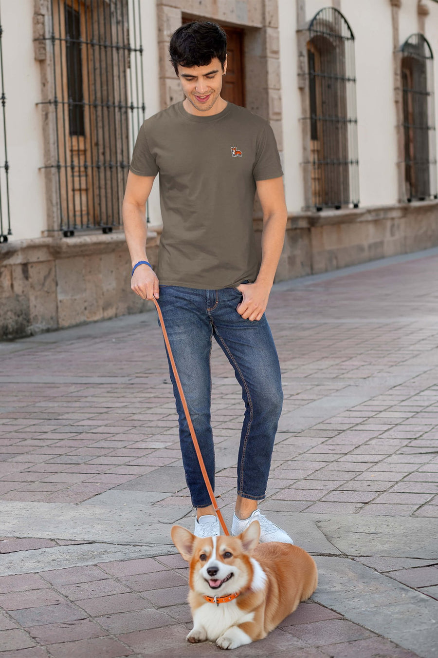 Model wearing the army green Corgi Bobtail Buddy T-Shirt from WOOF