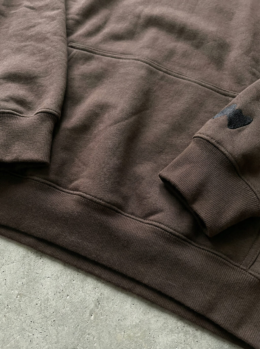 Close up of the french bulldog print on the brown hoodie from WOOF