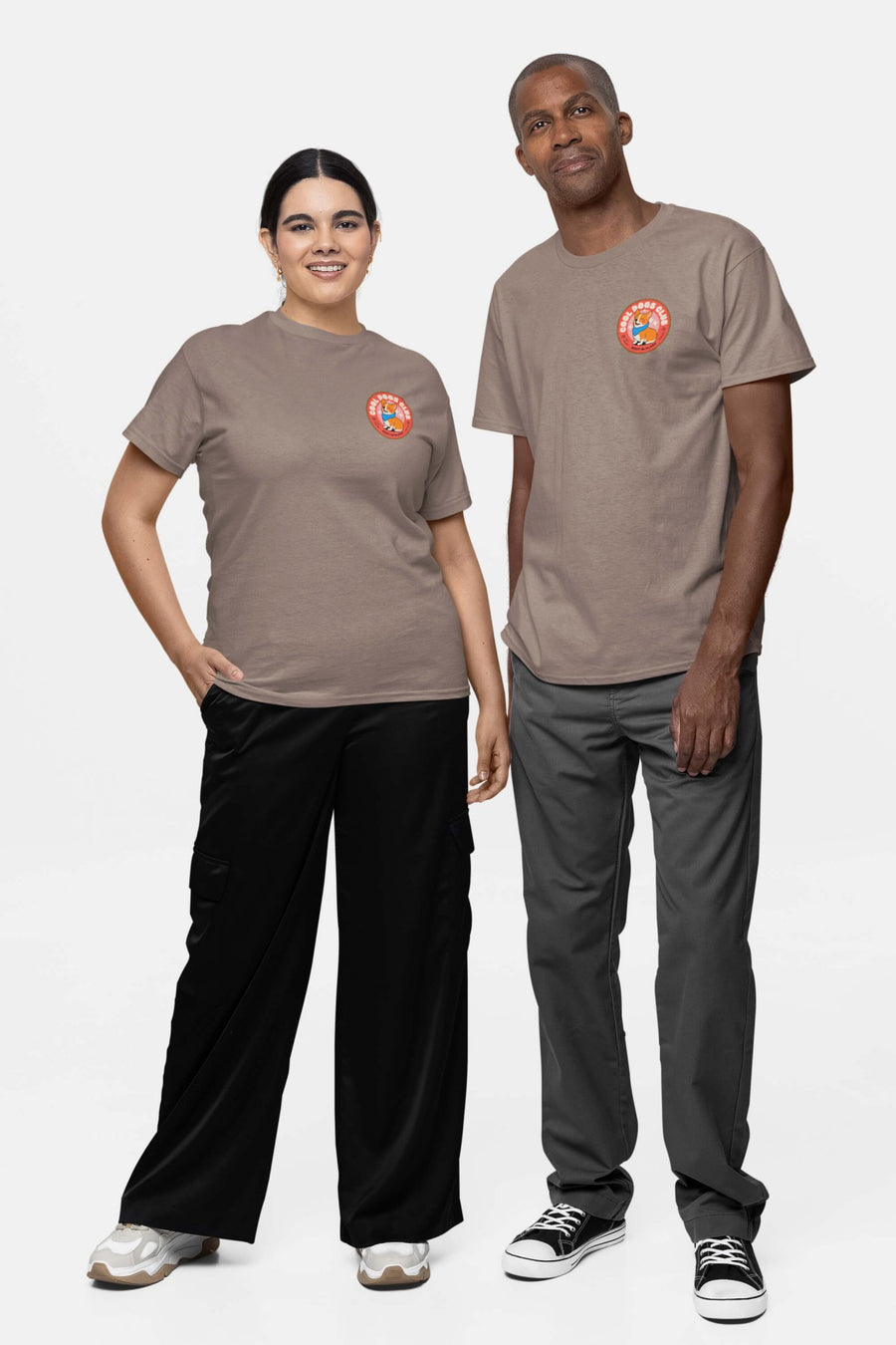 Two people in taupe Cool Dogs Club T-Shirts from WOOF with the chest badge, front view