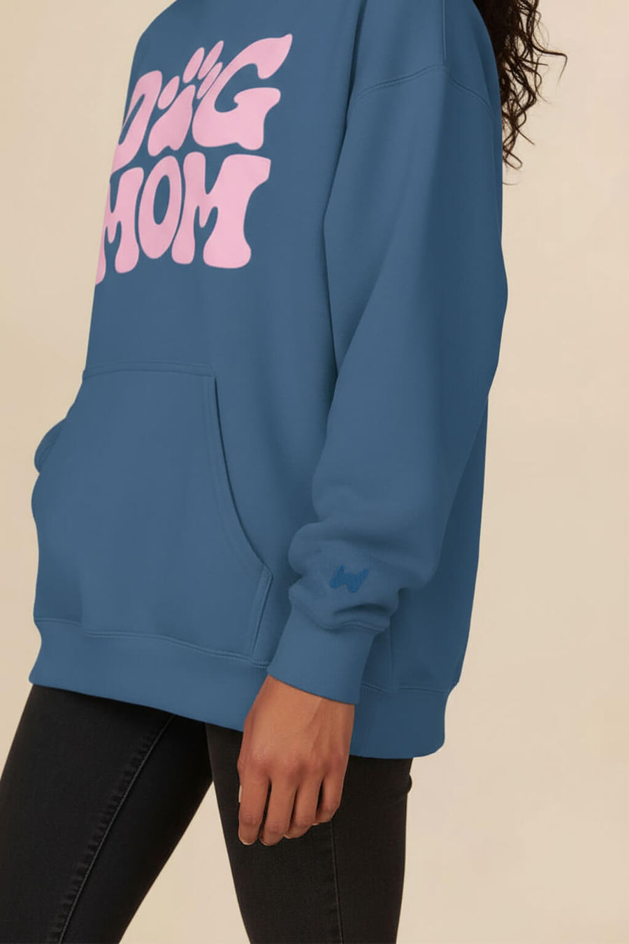 Print detail on the blue Dog Mom Hoodie from WOOF, showing the fleece texture