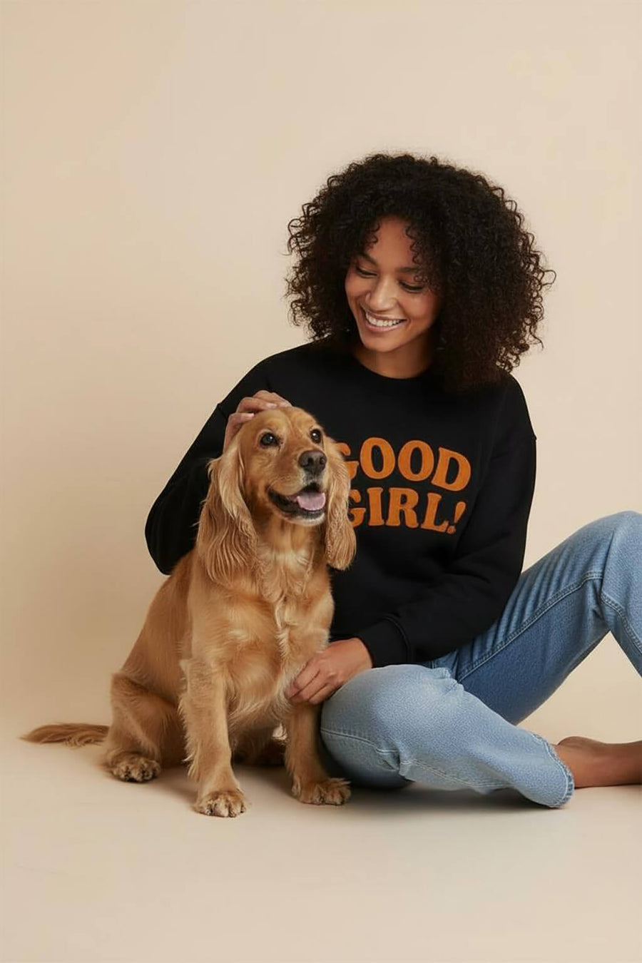 Front of the black Good Girl Crop Sweatshirt from WOOF on a plain background
