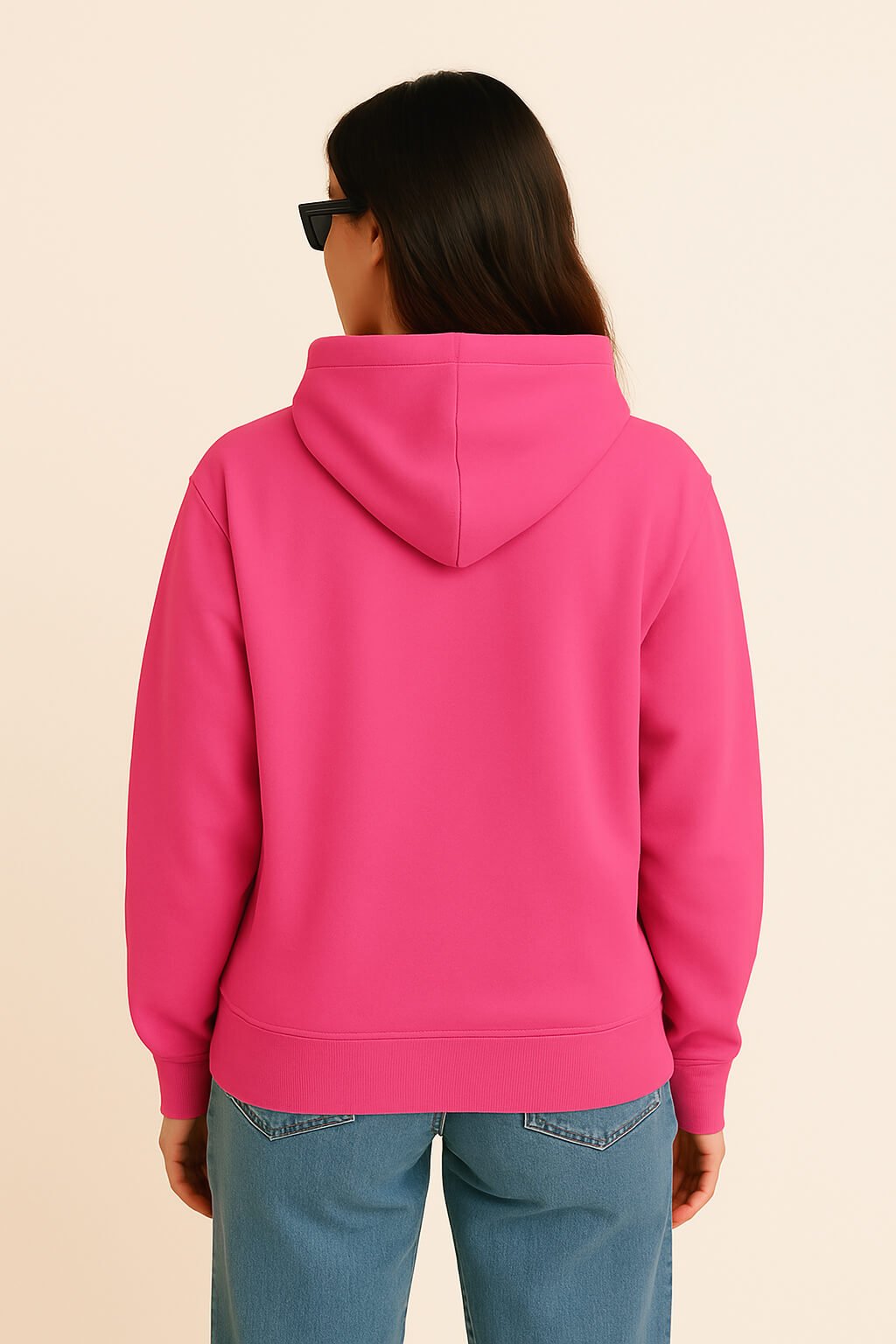 A person with long brown hair, wearing the Bold My Dog And I Talk Embroidered Hoodie from Dogloverclothing.com, blue jeans, and black sunglasses, is shown from the back against a plain light background.