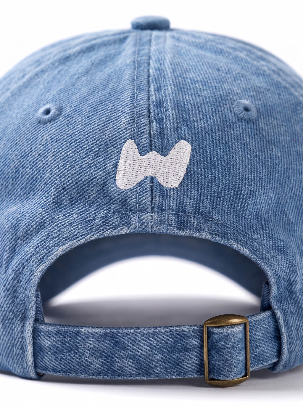 Stitching detail on the blue Corgi Denim Cap from WOOF