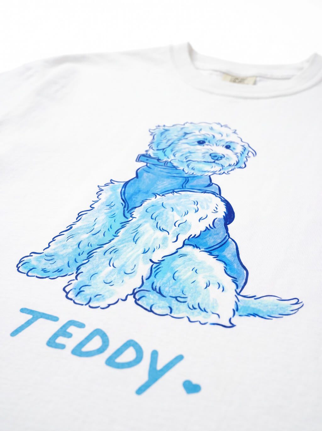 Print and fabric detail on the Custom Dog Caricature T-Shirt from WOOF