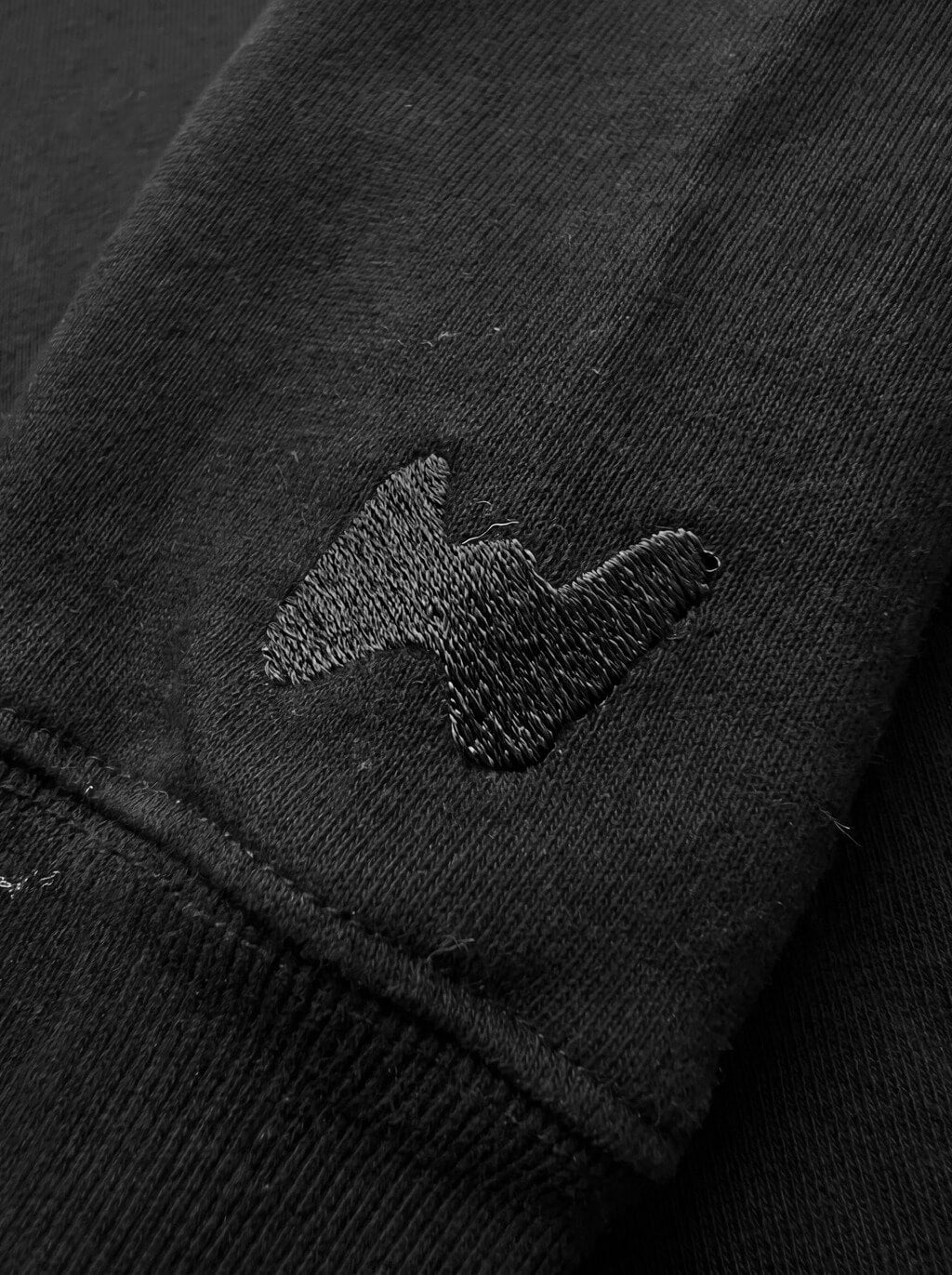 Fabric detail on the black Dog Mom Sweatshirt from WOOF
