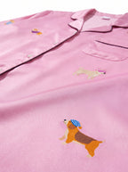 Fabric and print detail on the pink silky dog pajama set from WOOF