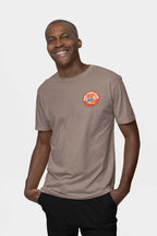 Radiating happiness, they wear the Cool Dogs Club Unisex Hype T-Shirt from Dogloverclothing.com in beige, showcasing the vibrant circular logo on the left chest, ideal for dog lovers, against a crisp white backdrop.
