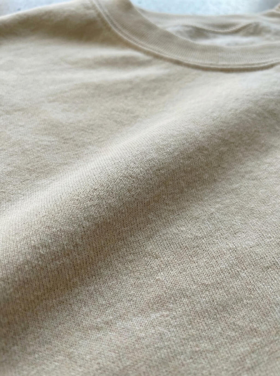 Stitching detail on the beige Embroidered Corgi Sweatshirt from WOOF