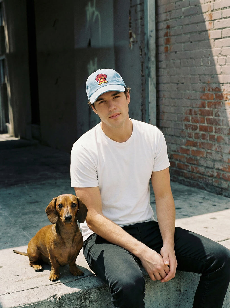 Light blue Dachshund embroidered denim cap from WOOF, front view