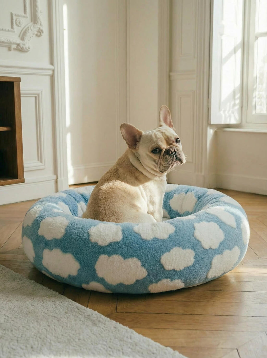 Cloud dog bed from WOOF with a dog curled up inside
