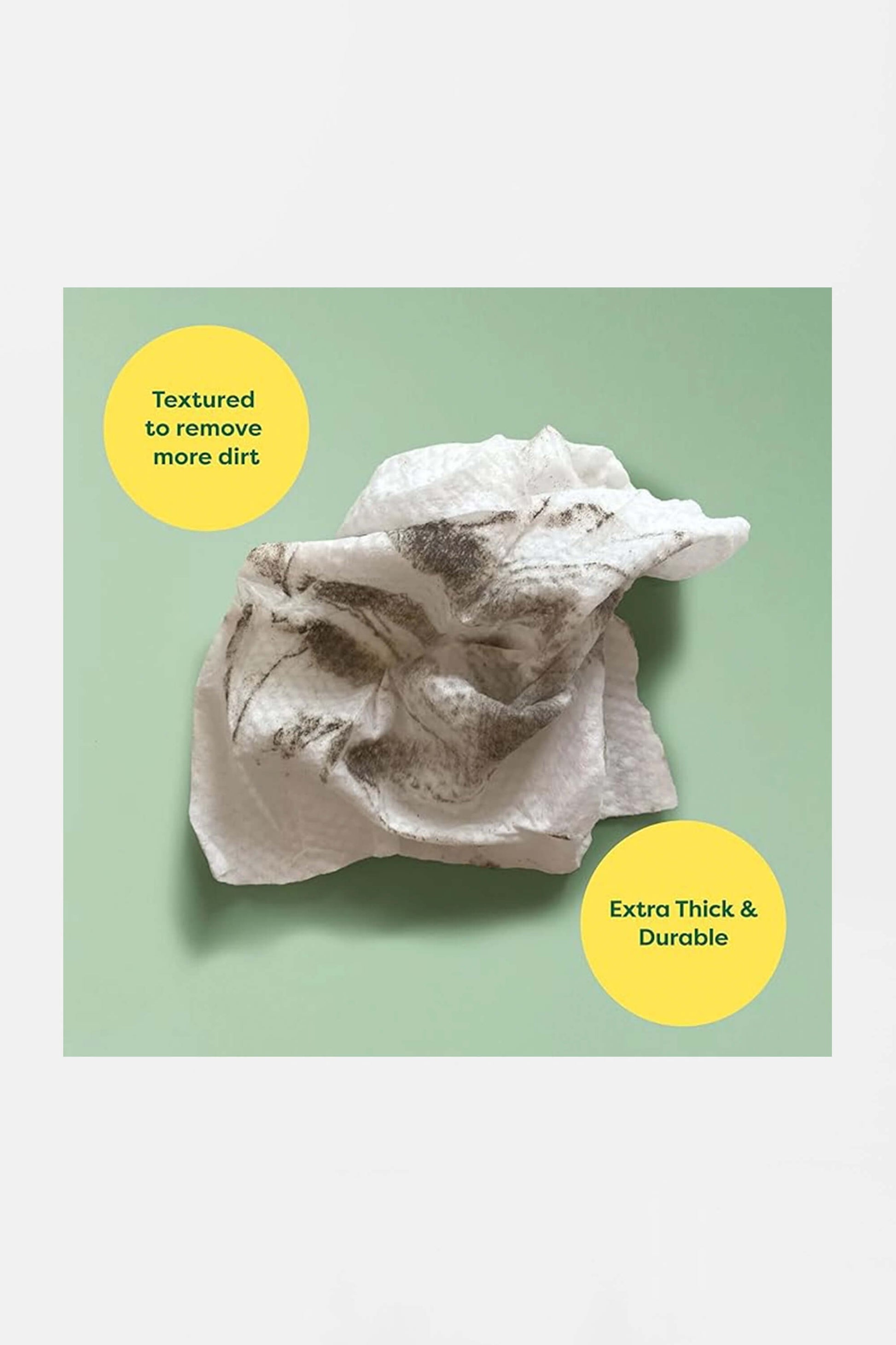 A crumpled, dirt-streaked white Hypoallergenic Earth Rated Pet Wipe by Amazon on a light green background. Yellow circles highlight features: Textured to remove more dirt and Extra Thick & Durable.