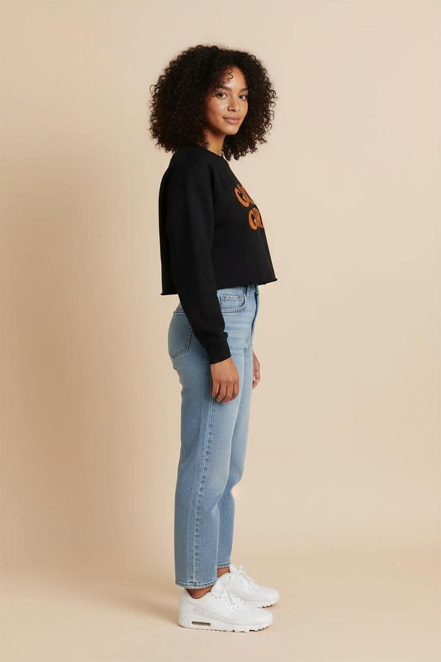 Side view of the black Good Girl Crop Sweatshirt from WOOF