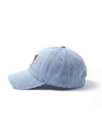 Side view of the blue Tricolor Corgi Denim Cap from WOOF