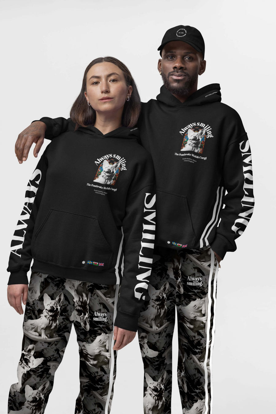 Couple wearing the Corgi Supreme Tribute Joggers and hoodies from WOOF, front view