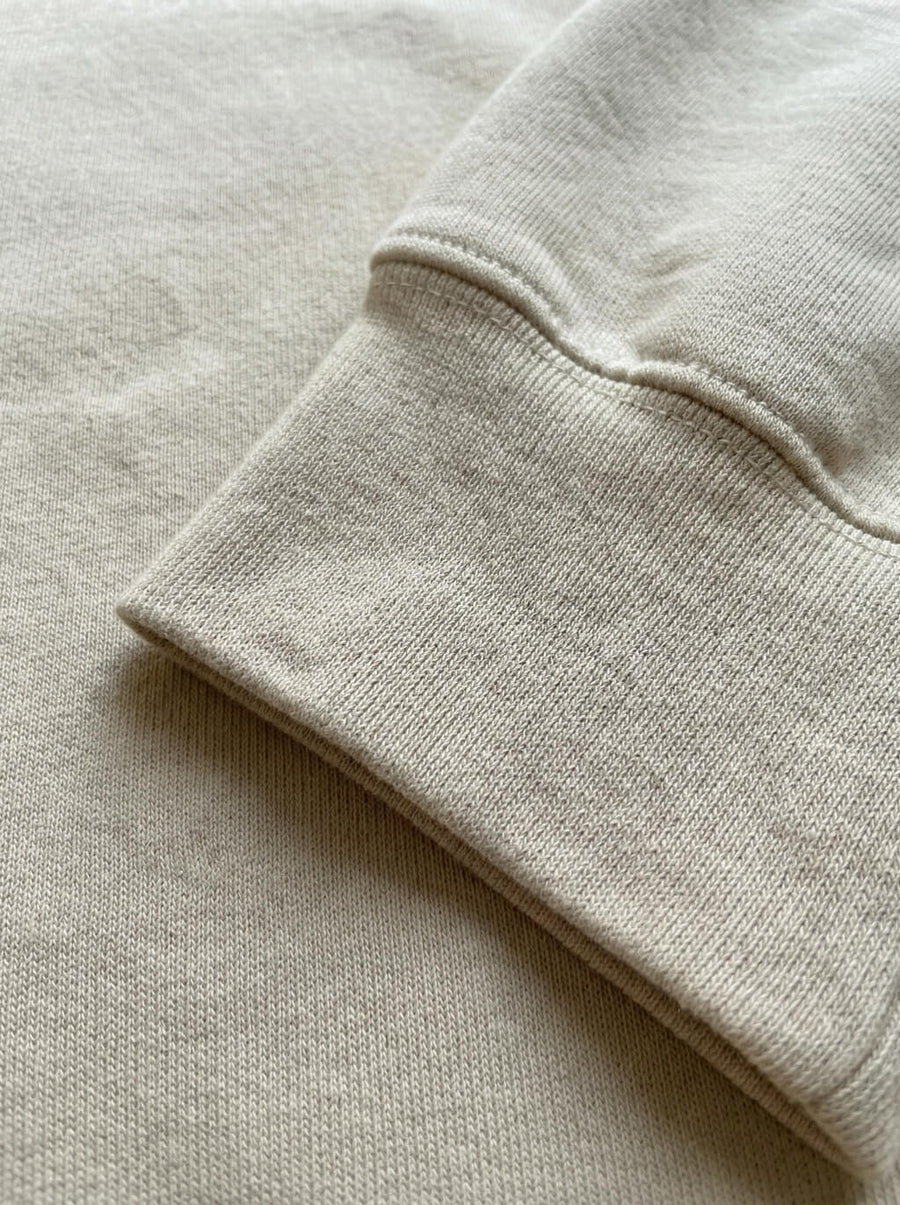 Cuff and fabric detail on the beige Embroidered Corgi Sweatshirt from WOOF