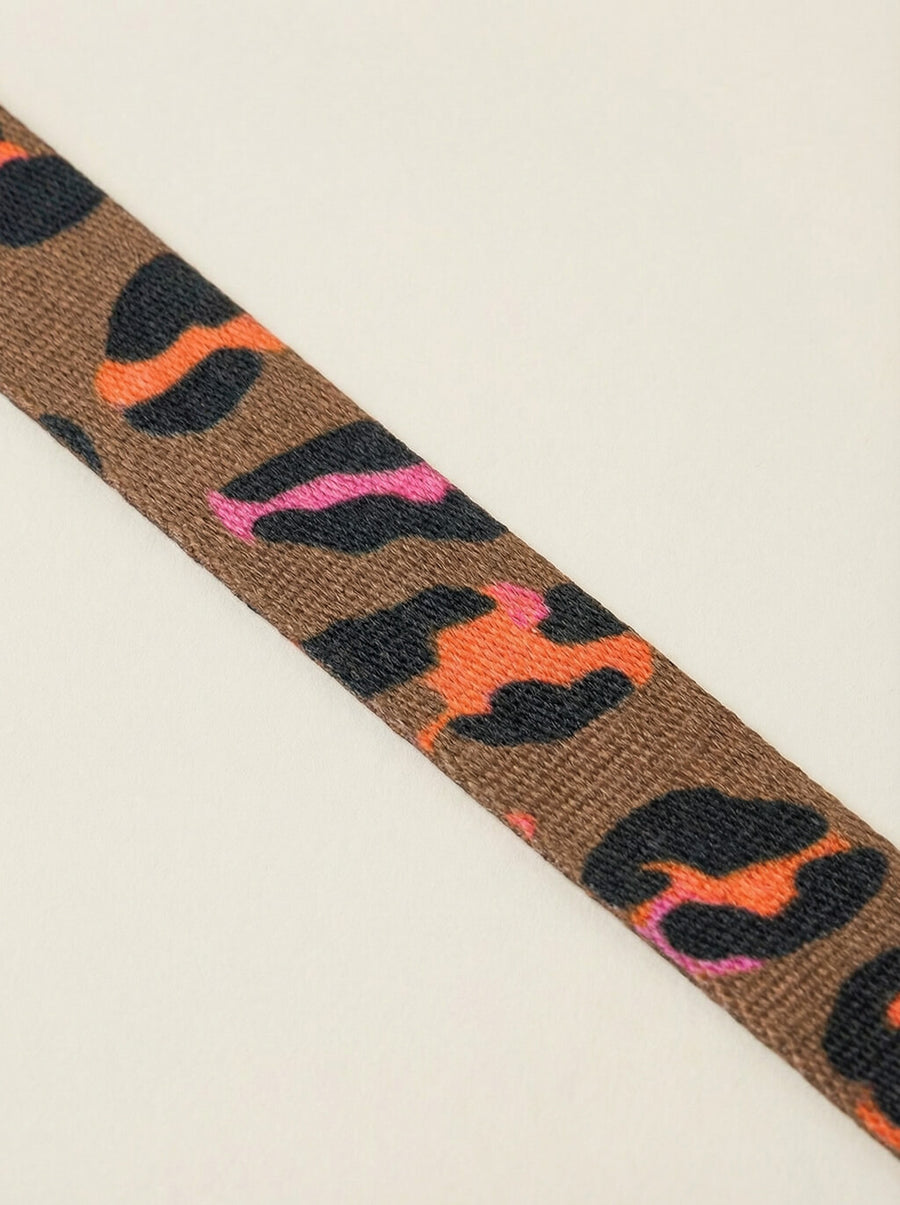 Close up of the leopard print on the collar and leash set from WOOF