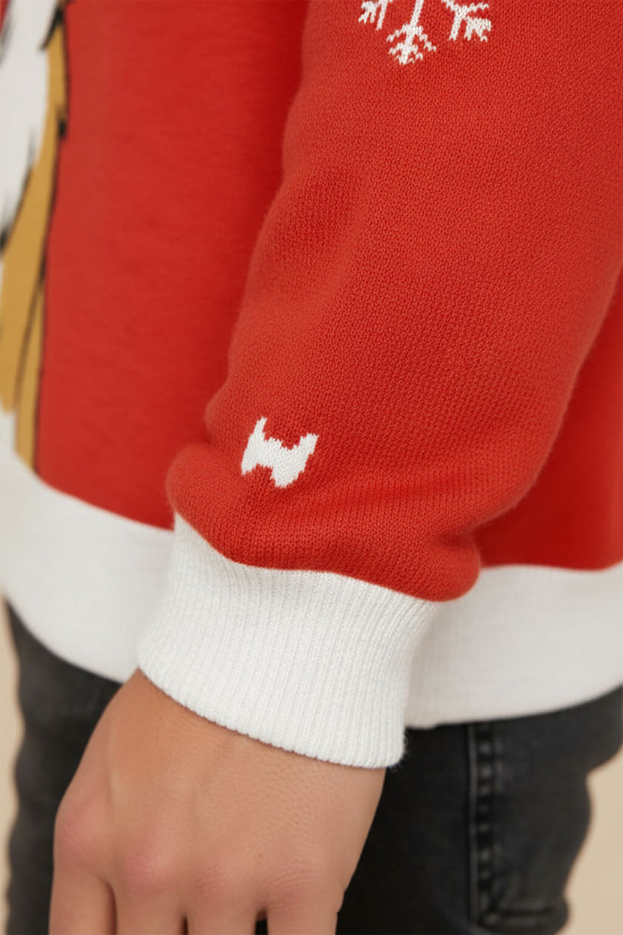 Close up of the knit texture on the Corgi Christmas sweater from WOOF