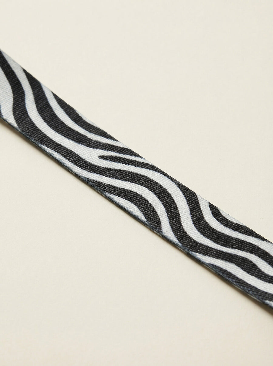 Close up of the zebra print on the collar and leash set from WOOF