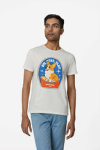 A man wears the Best Dog Supreme Tribute Unisex T-Shirt from Dogloverclothing.com, featuring a cartoon Corgi and text, SIT-STAY-SLAY and BEST DOG. Ideal for dog lovers, he pairs it with light blue jeans. The scene is set against a plain white background.