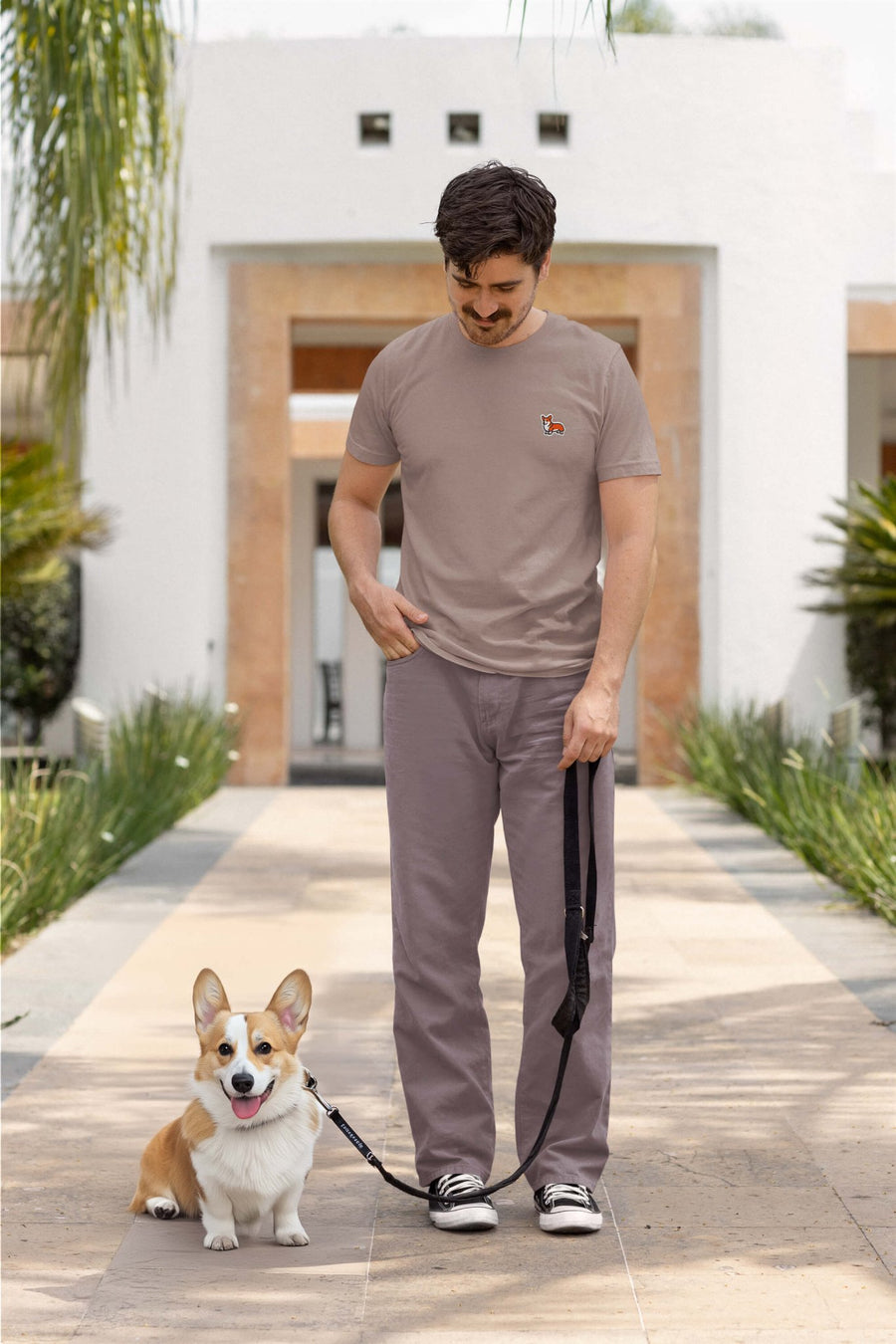 Model wearing the pebble Corgi Bobtail Buddy T-Shirt from WOOF