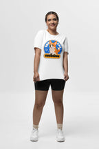 In a studio, someone wears the You are Corgeous Supreme T-Shirt from Dogloverclothing.com. It features a colorful cartoon corgi and Born To Be Corgelous. Ideal for dog lovers, theyre styled with black shorts, ankle socks, and sneakers against a plain white backdrop.