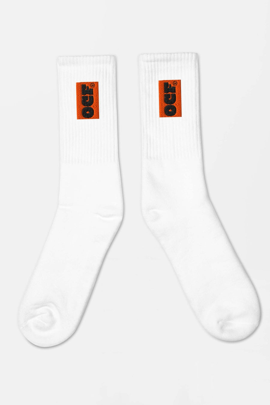 White SOCCO x Corgi Fan Club socks from WOOF, front view of the embroidery