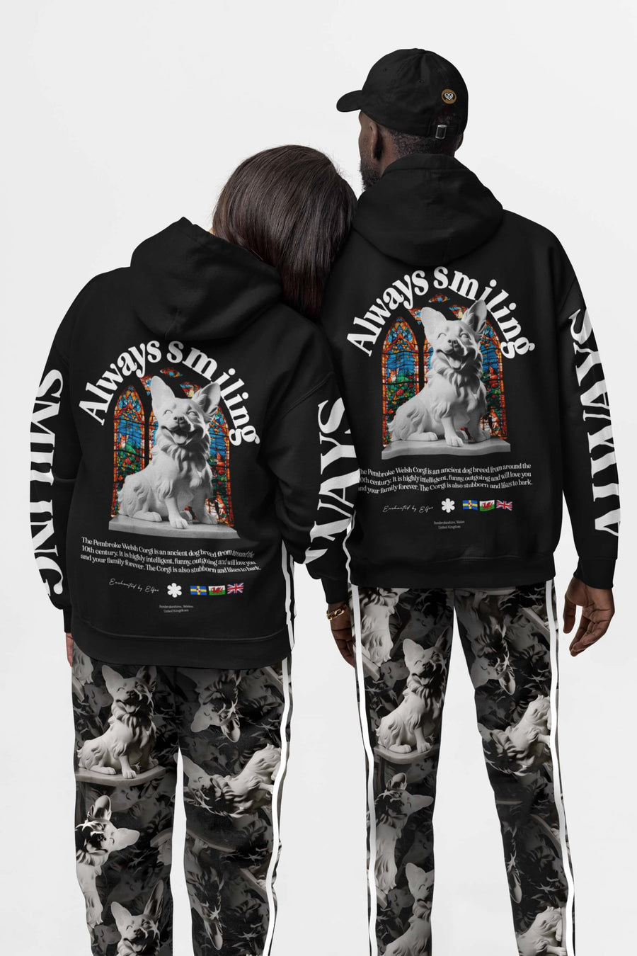 Two people in matching Corgi Supreme Tribute Joggers and hoodies from WOOF, seen from the back