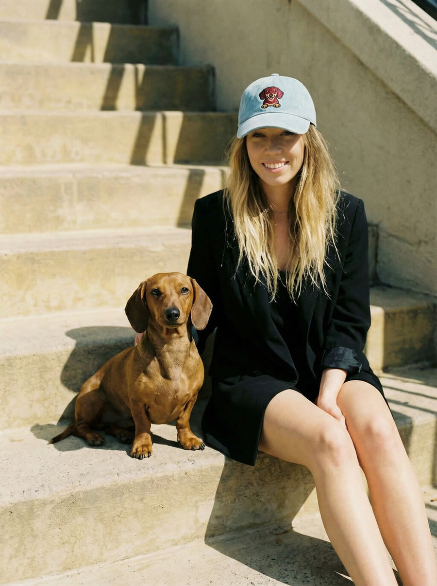 Light blue Dachshund denim cap from WOOF on a plain background