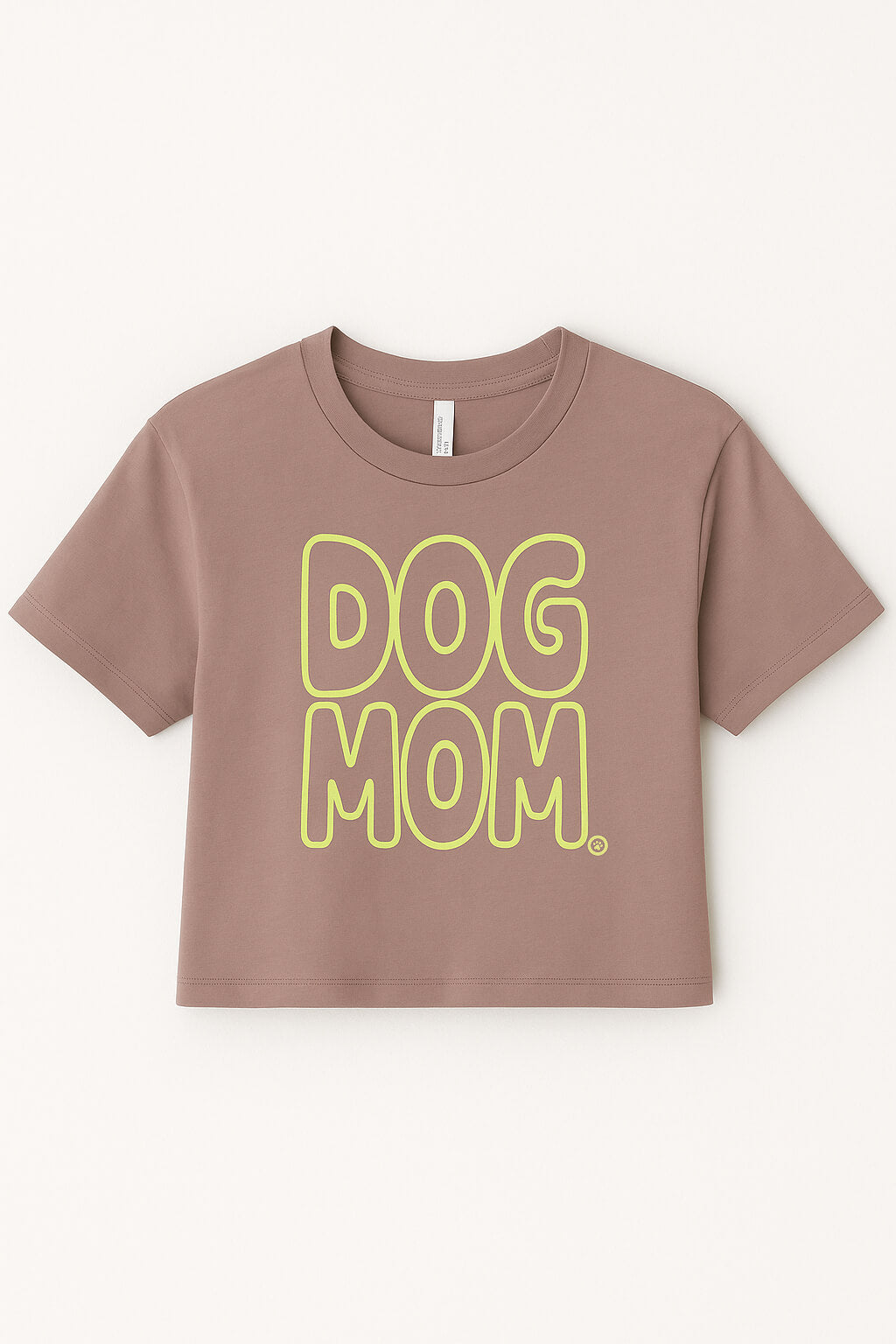 The Oversized Dog Mom Crop Top by Dogloverclothing.com features bold yellow DOG MOM bubble letters on brown fabric, styled in a relaxed fit—perfect for showing off your dog mom lifestyle. Displayed against a plain light background.