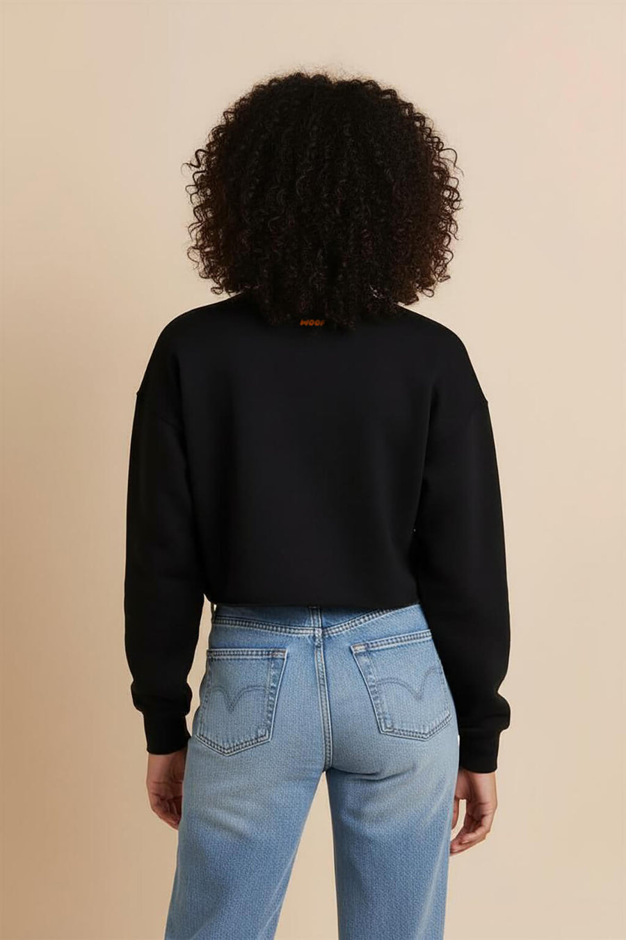 Back view of the black Good Girl Crop Sweatshirt from WOOF