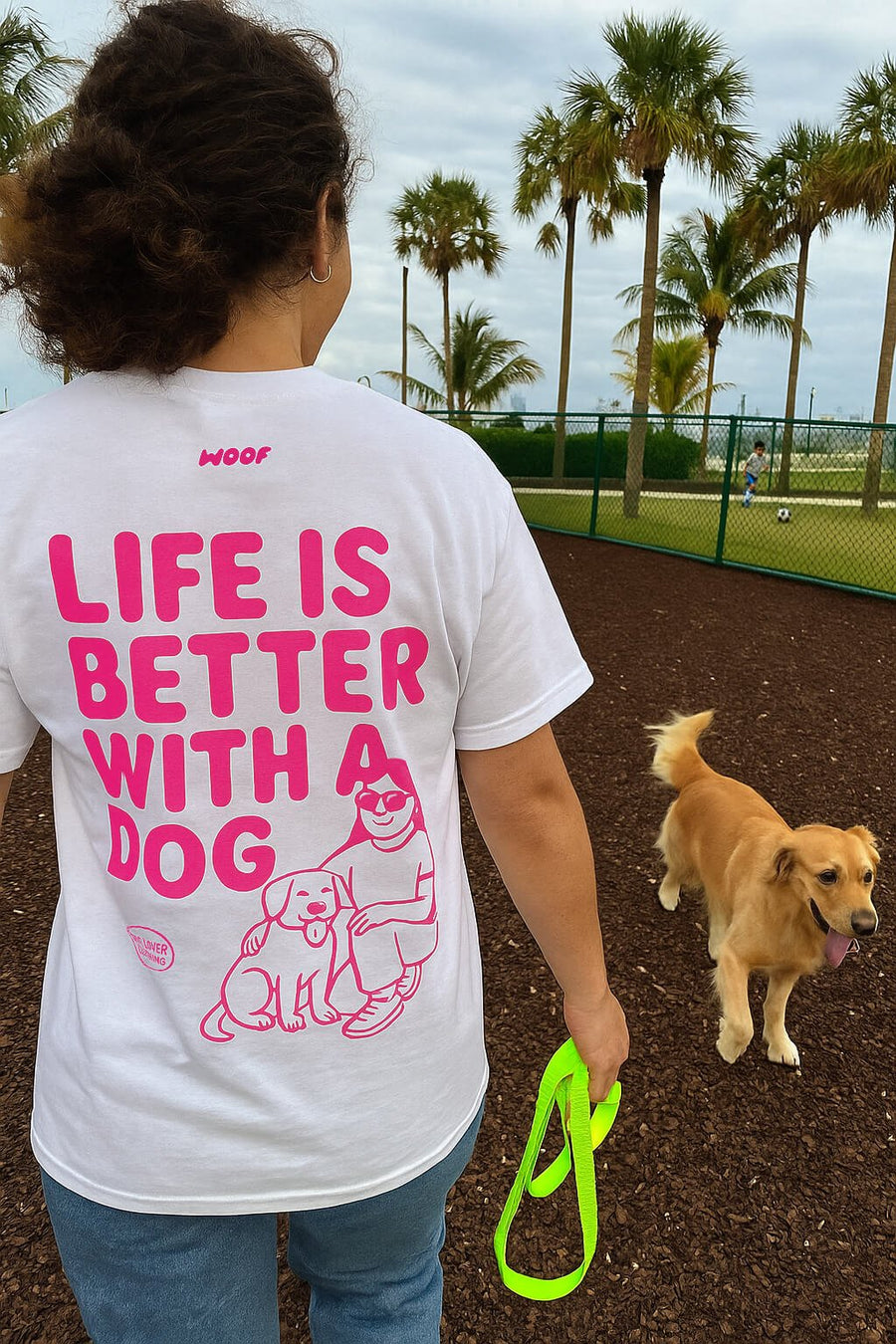 Model wearing the white Soft Life is Better with a Dog T-Shirt from WOOF