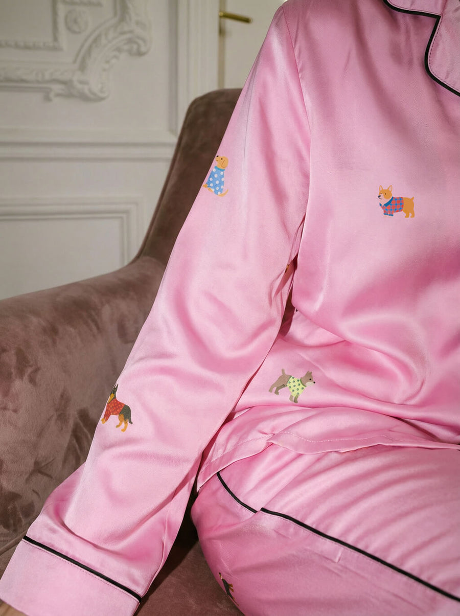 Close up of the dog print on the pink pajama set from WOOF