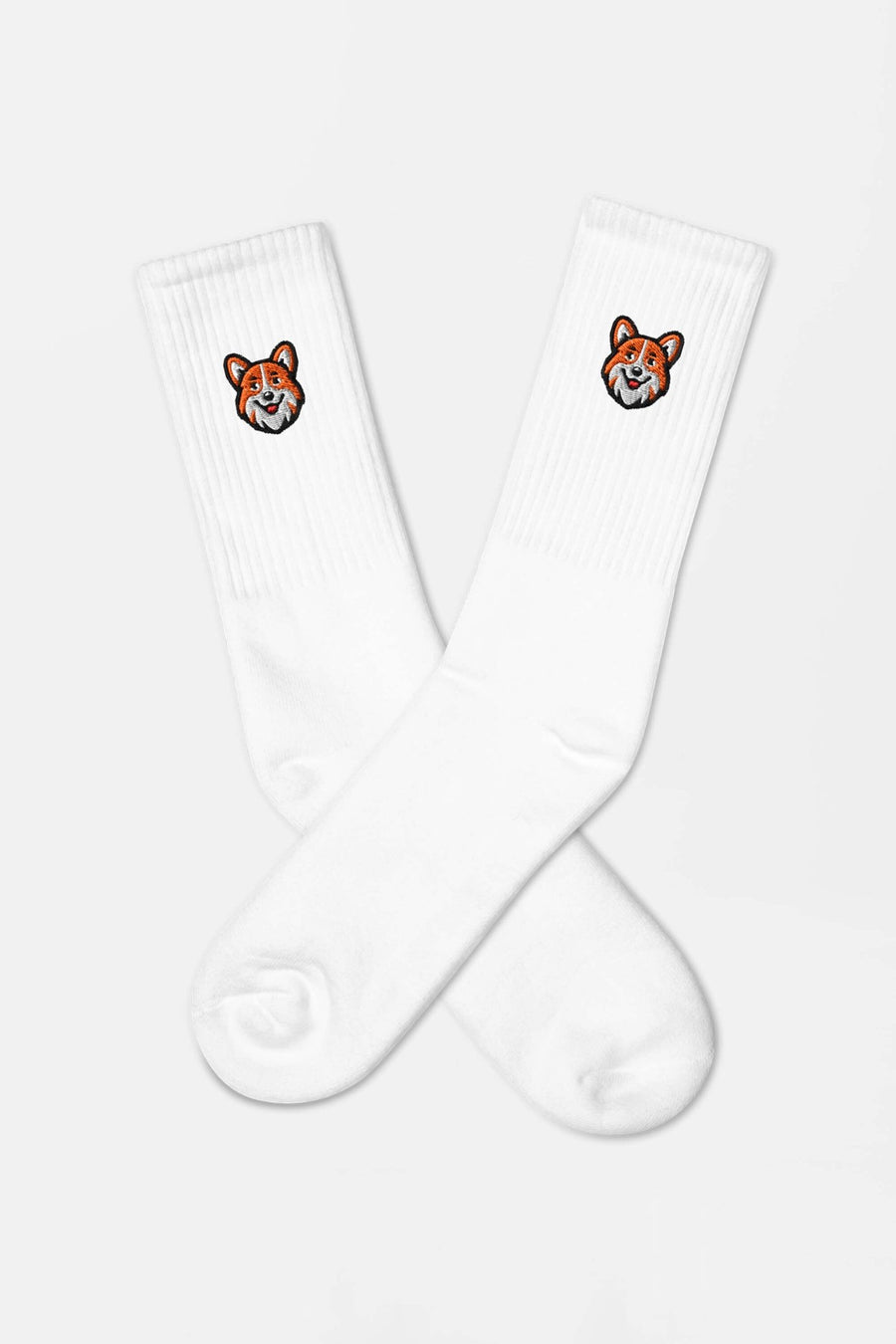 Close up of the corgi embroidery on the white SOCCO socks from WOOF