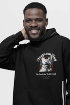 A man smiles in an eco-friendly Corgi Supreme Tribute Hoodie by Dogloverclothing.com, crafted from recycled materials. It features a Pembroke Welsh Corgi with Always Smiling above the dogs image and The Pembroke Welsh Corgi against a colorful background.