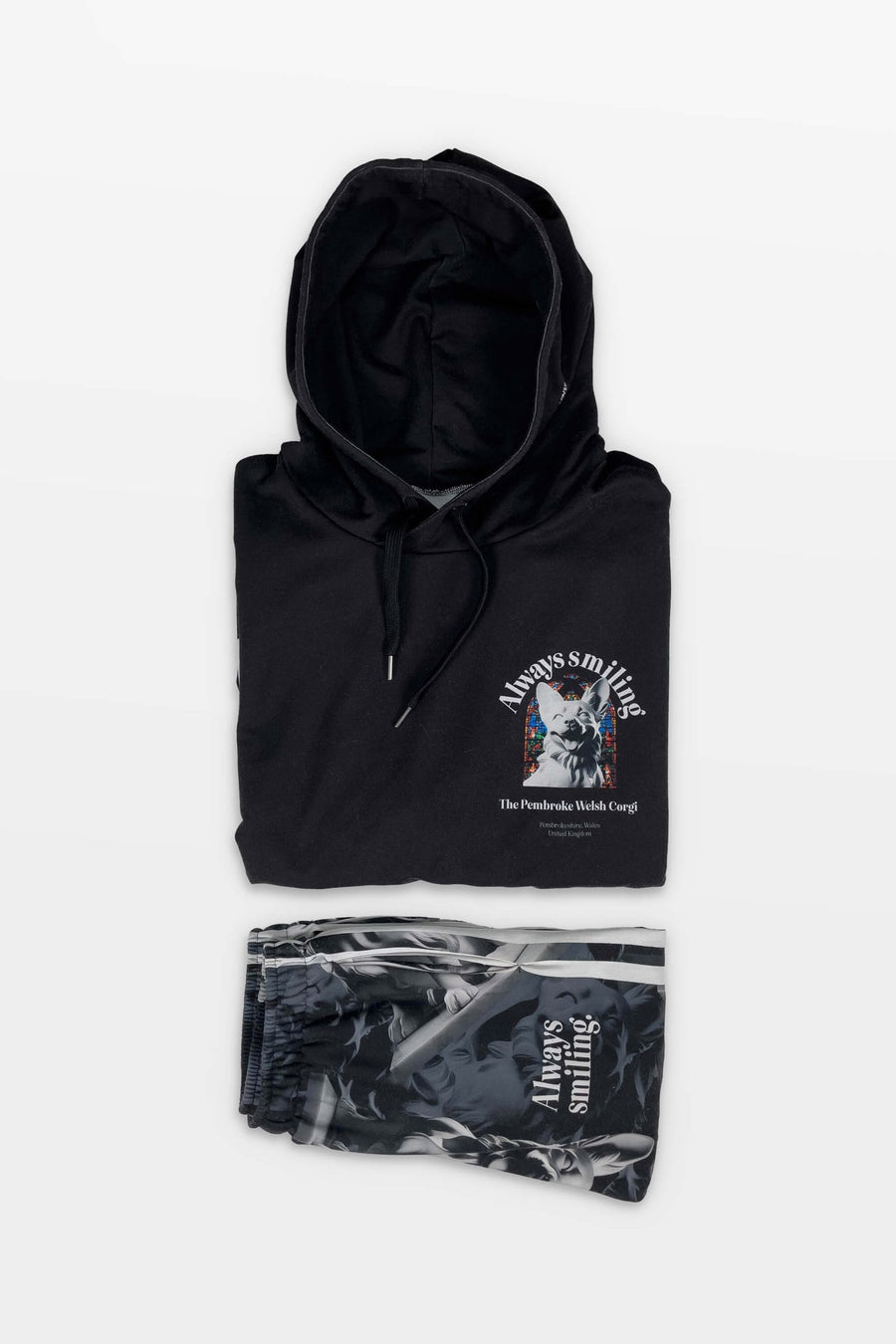 Flat lay of the Corgi Supreme Tribute Hoodie and joggers from WOOF