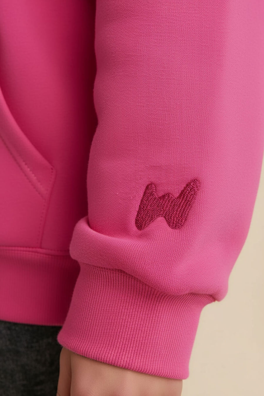 Close up of the fleece and cuff on the pink Dog Mom Hoodie from WOOF
