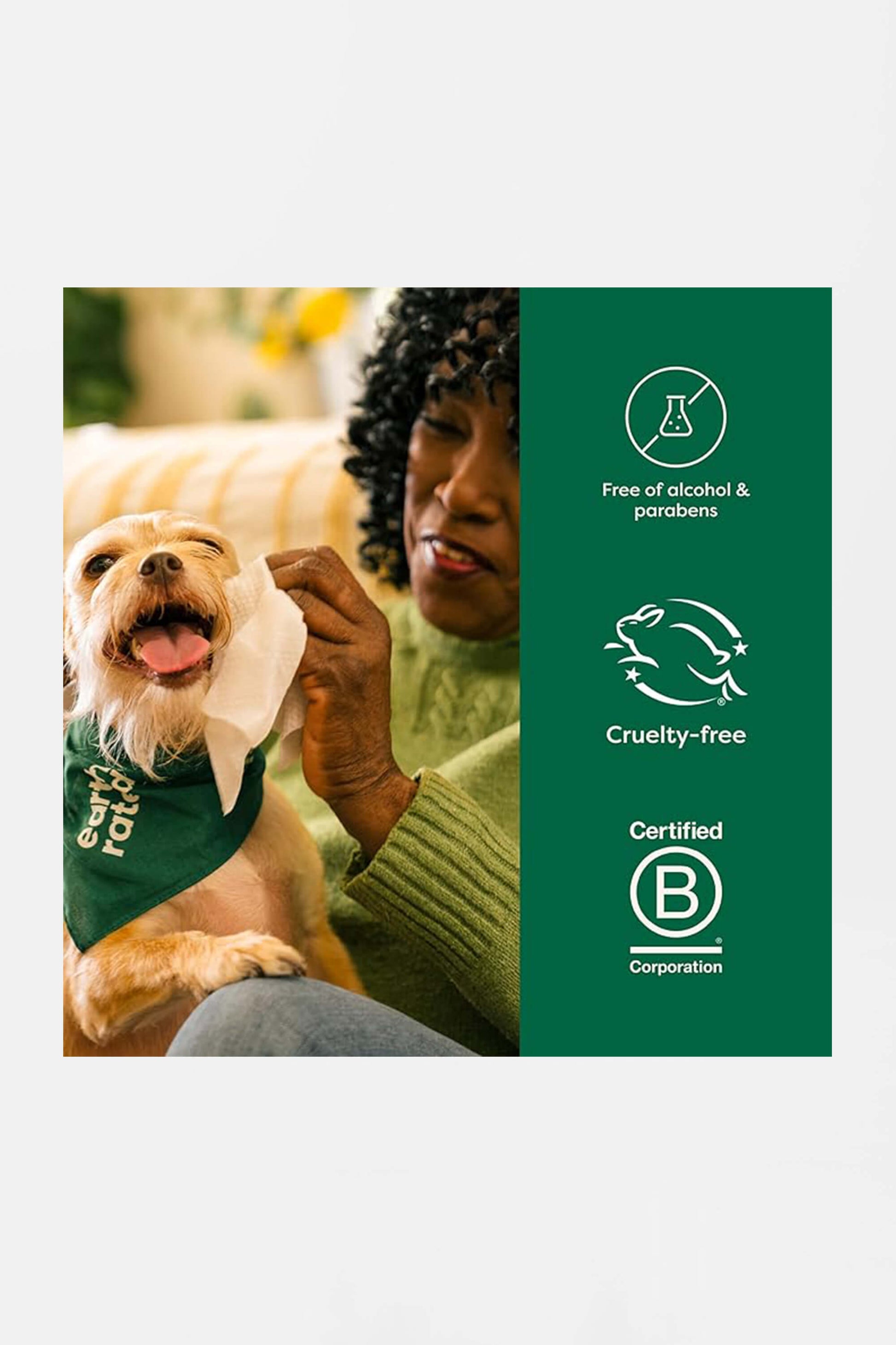 A person gently wipes a happy dogs face with an Amazon Hypoallergenic Earth Rated Pet Wipe, while the dog wears a green bandana. Icons indicate the product is alcohol-free, paraben-free, cruelty-free, and certified B Corporation.