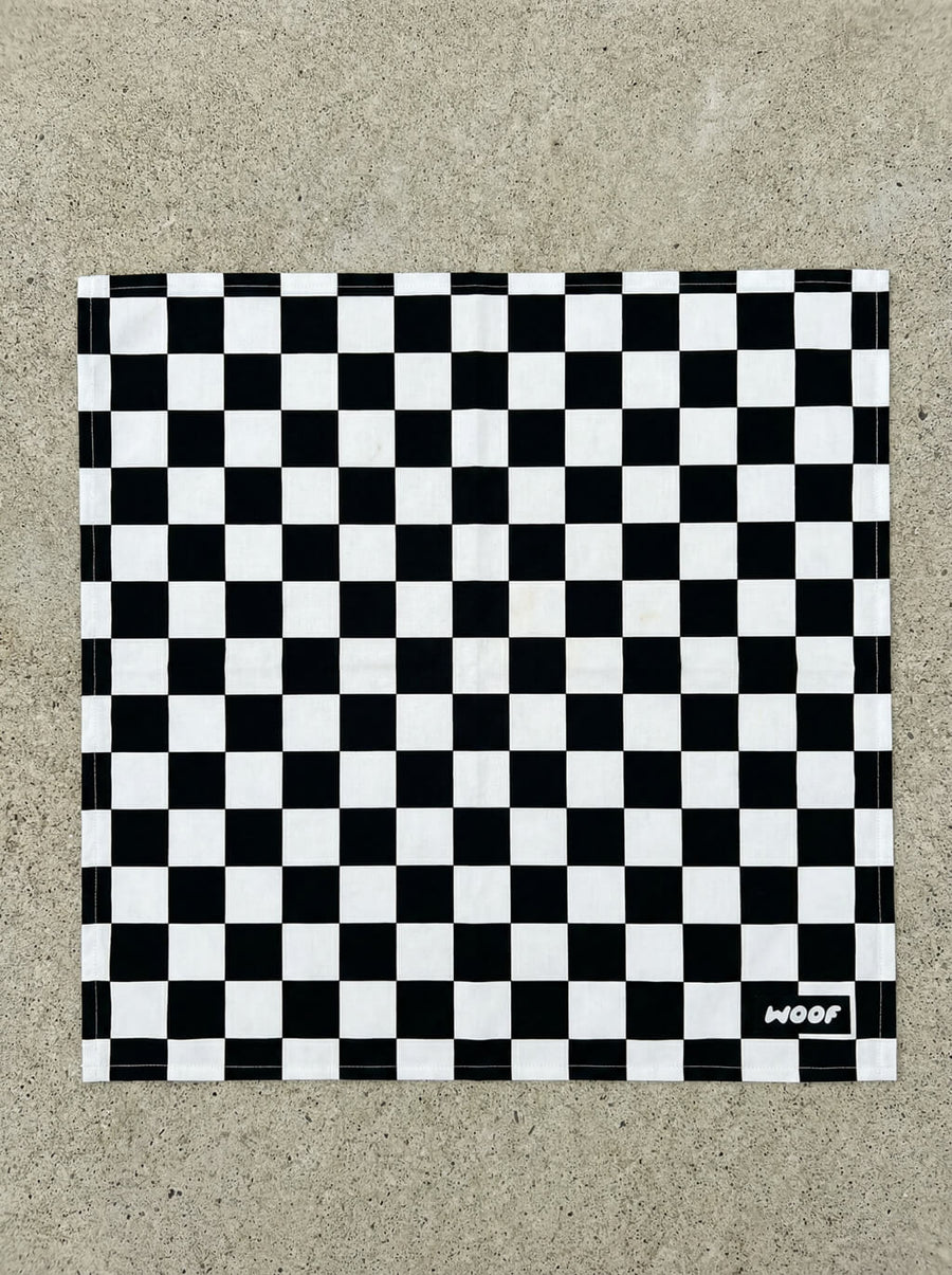 Flat lay of the timeless checkered dog bandana from WOOF