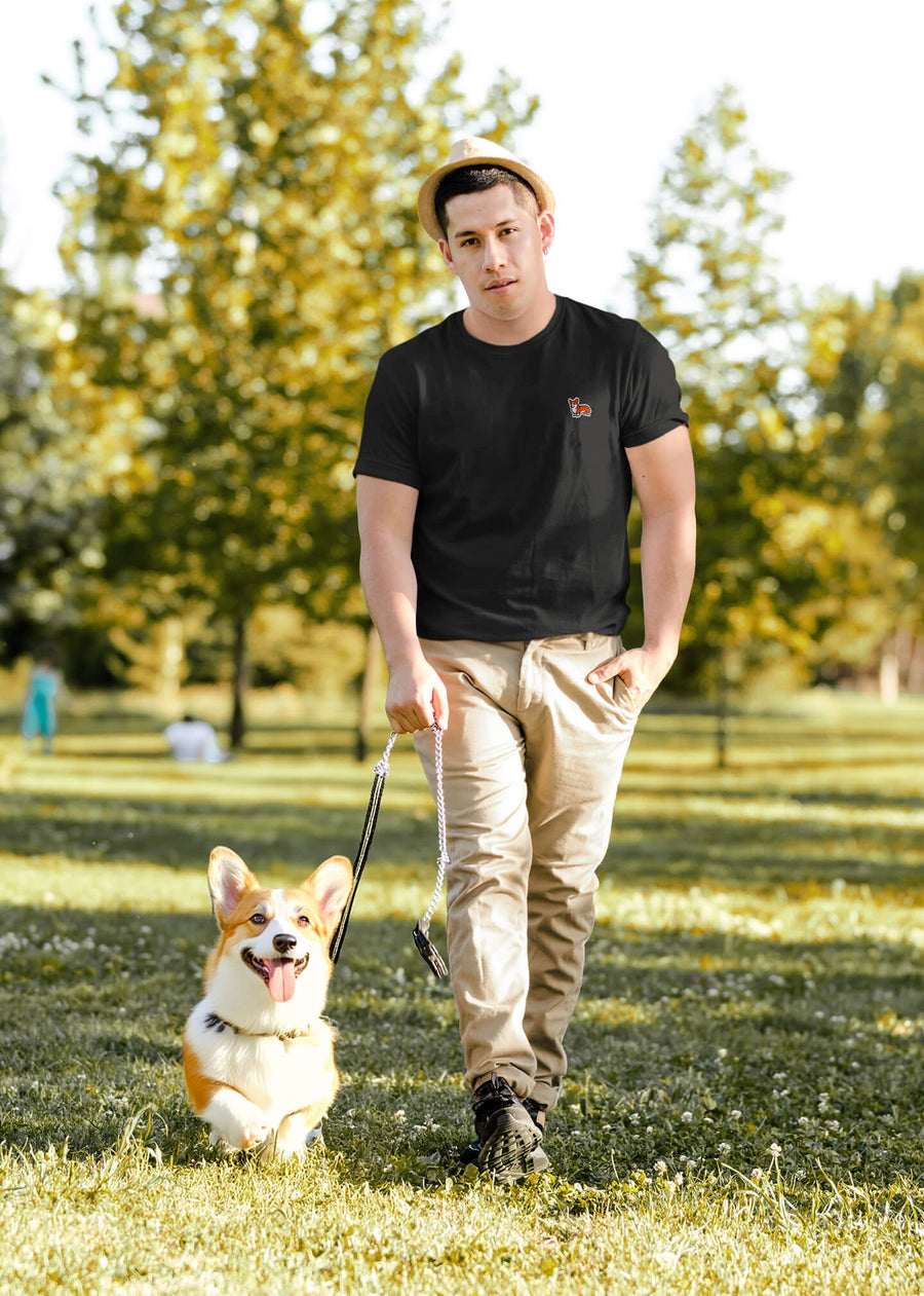 Model wearing the black Corgi Bobtail Buddy T-Shirt from WOOF