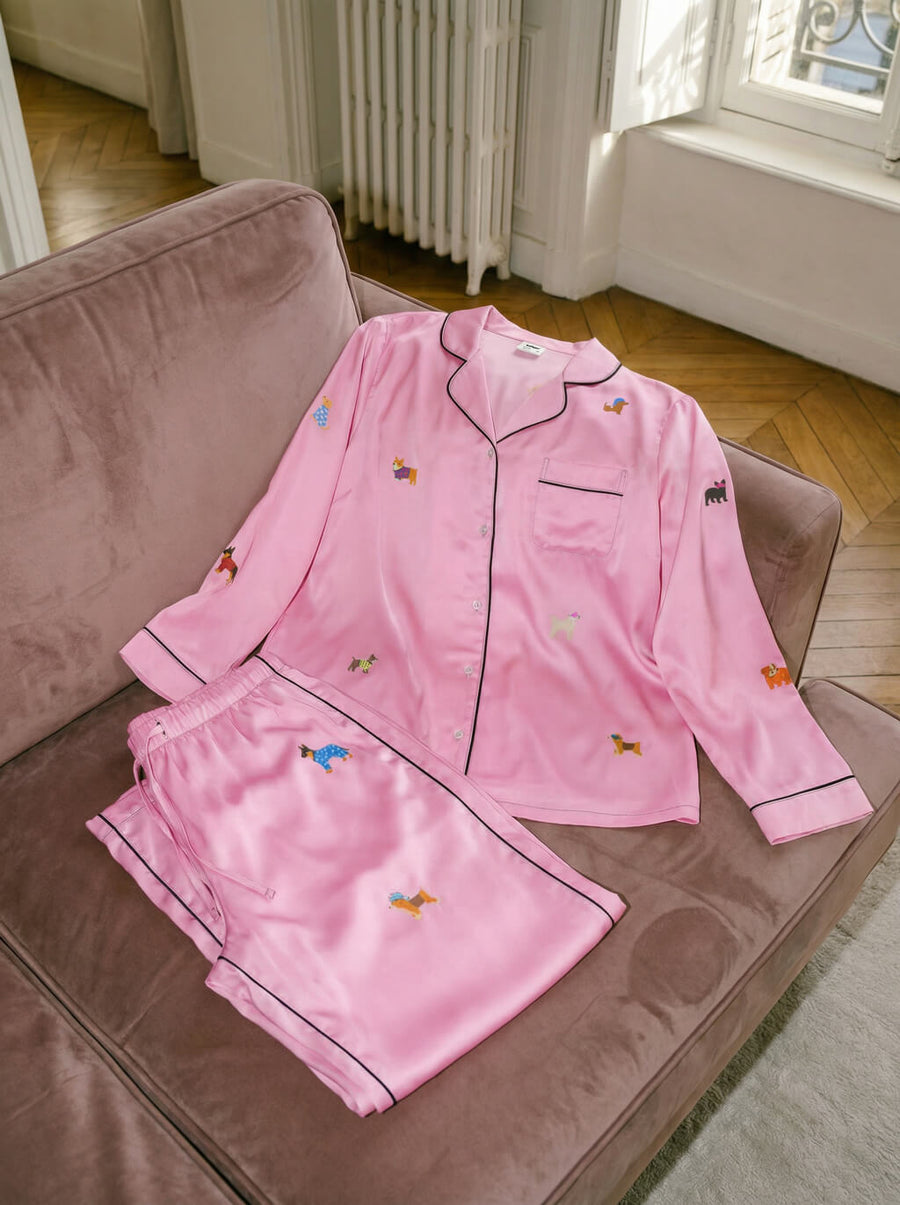 Flat lay of the pink Valentines Day dog pajama set from WOOF