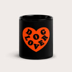 The Dog Lover Mug from Dogloverclothing.com is a black mug with a large orange heart featuring DOG LOVER in bold, celebrating everything dog-themed.