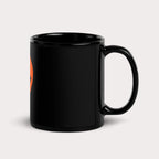 The Dogloverclothing.com Dog Lover Mug is a black ceramic mug with an eye-catching partial orange circle and stylized black B, perfect for dog item collectors, beautifully highlighting its design against a plain gray background.