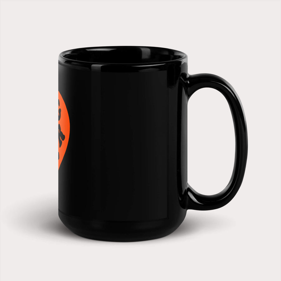 Glossy black Dog Lover Mug from WOOF with an orange sprinting dog silhouette