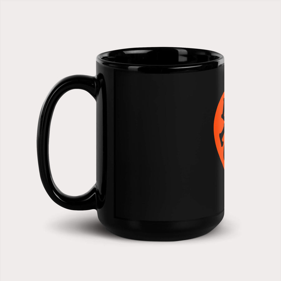 Black Dog Lover Mug from WOOF with an orange smiling pumpkin face graphic