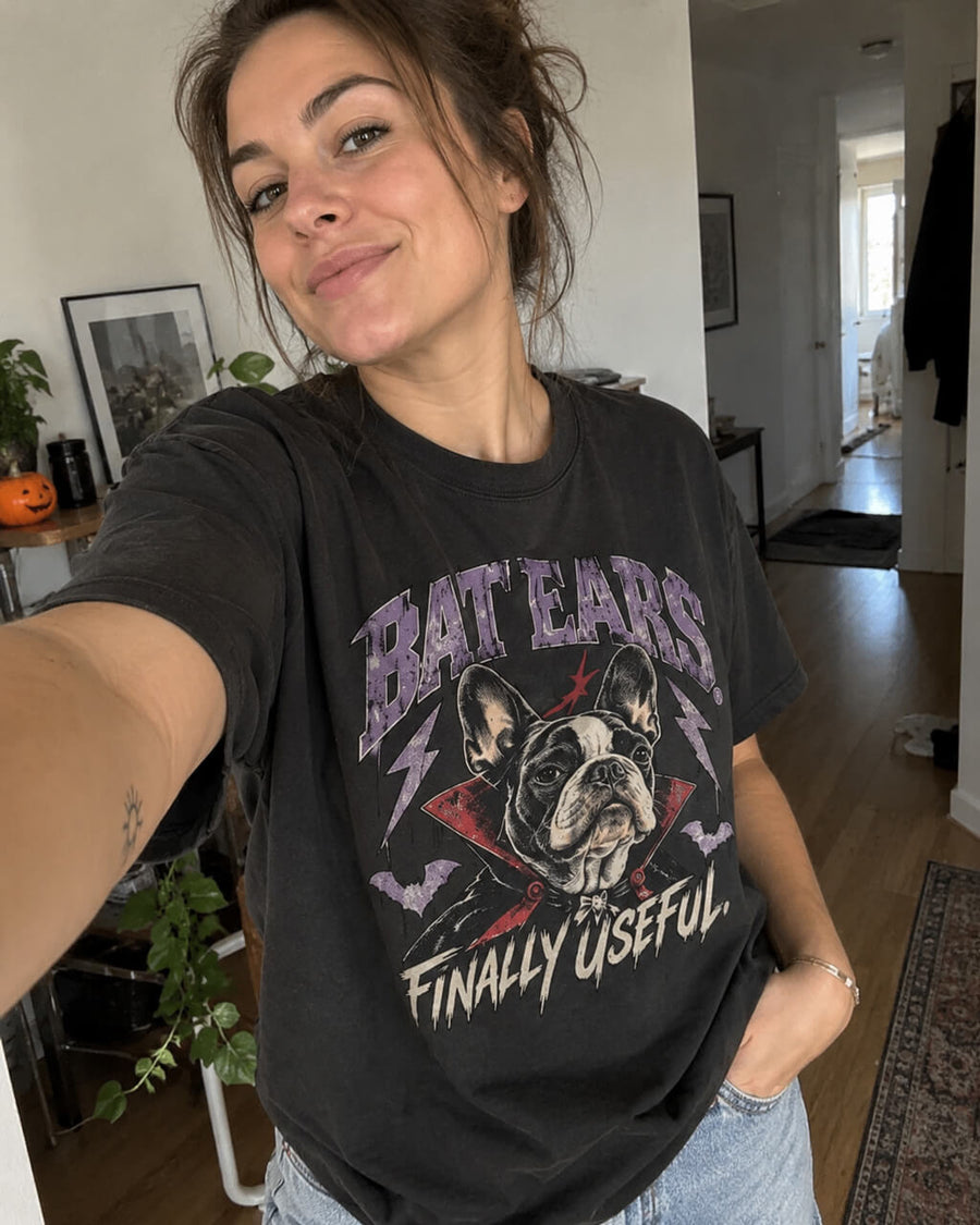 Bat Ears Frenchie oversized Halloween T-shirt in Washed Black worn by a woman taking a selfie at home