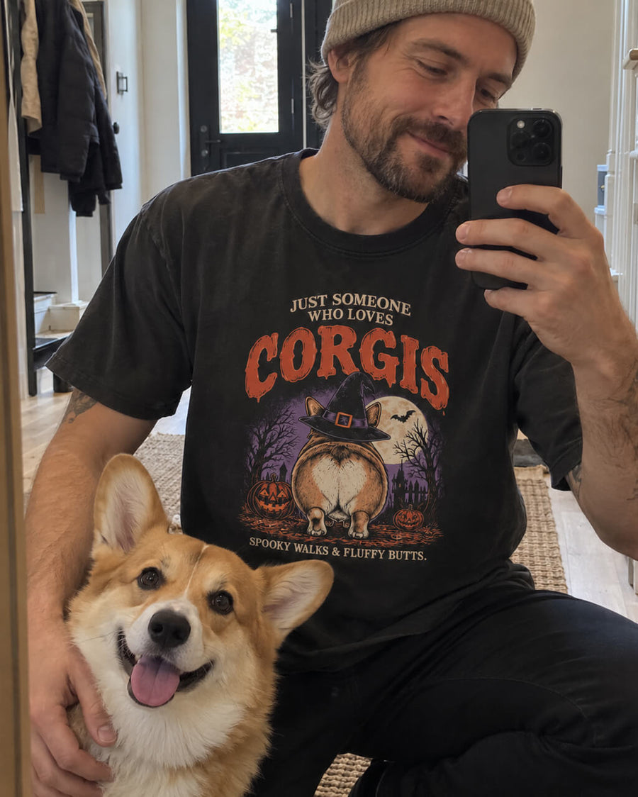 Corgi Butts Halloween oversized T-shirt in Washed Black worn by a man taking a mirror selfie with his Corgi