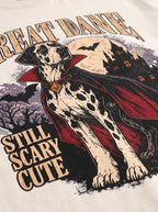 Close-up of the "Great Dane – Still Scary Cute" print with a Harlequin Great Dane in a vampire cape on the Vintage White tee