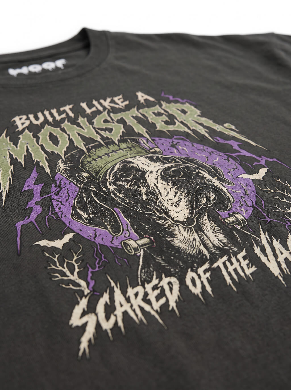 Close-up of the "Built Like a Monster. Scared of the Vacuum." print with a Frankenstein Great Dane on the Washed Black tee