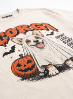 Close-up of the "Corgi – Short Legs, Scary Good Vibes" print with a Corgi in a ghost sheet on the Vintage White tee